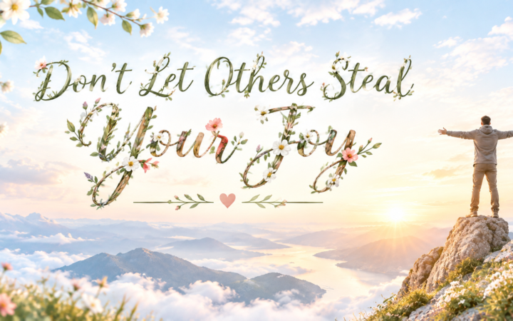Don't let others steal your joy man standing on mountain with arms open at sunrise